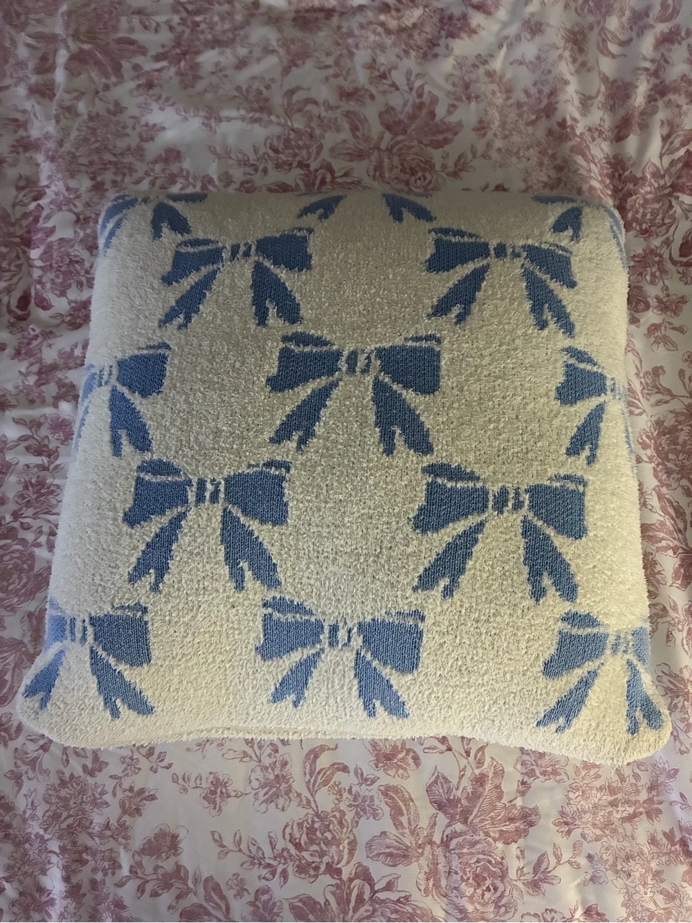 Cream Pillow with Blue Bow Pattern